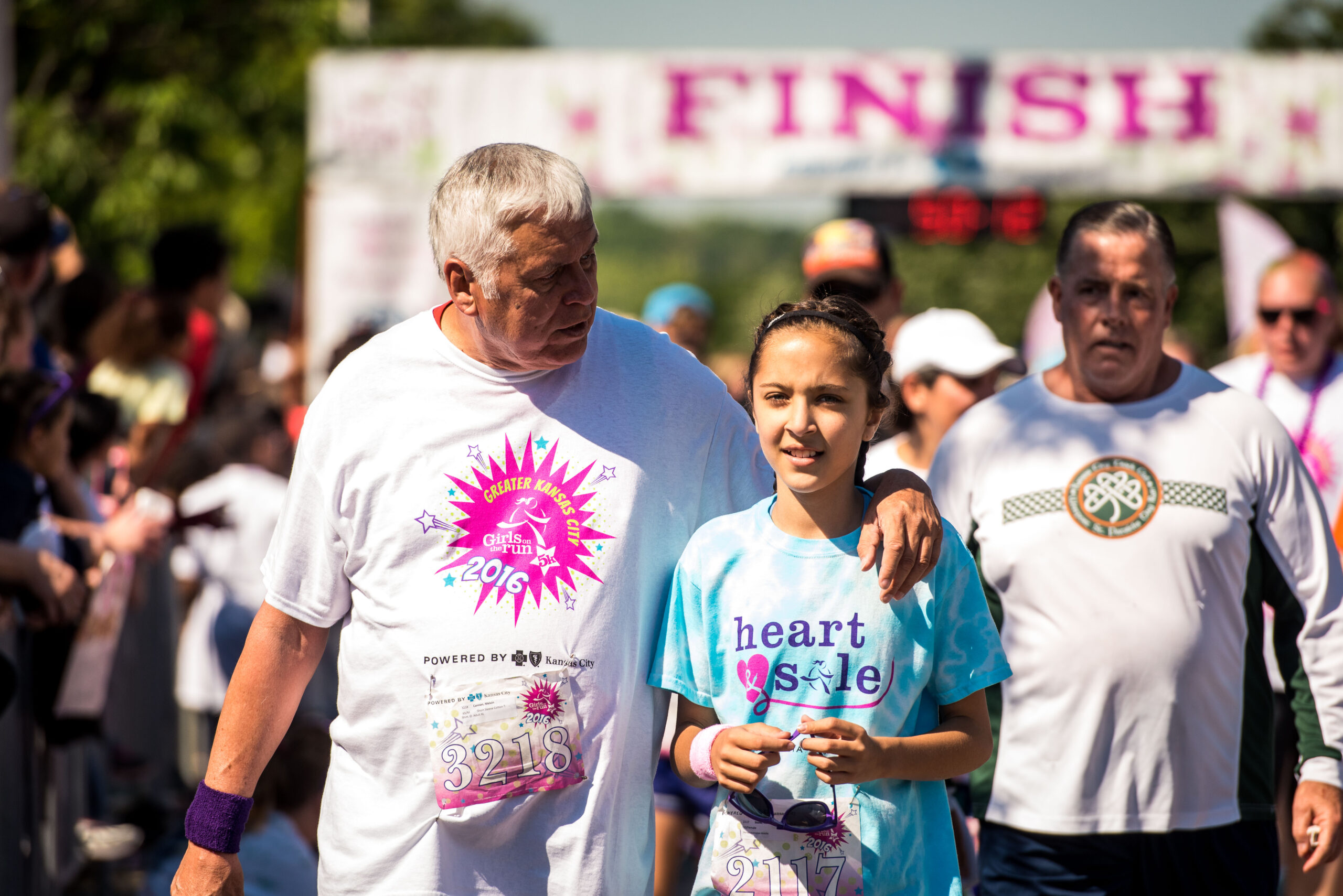 Girls on the Run girl at the celebratory 5K with her supporters