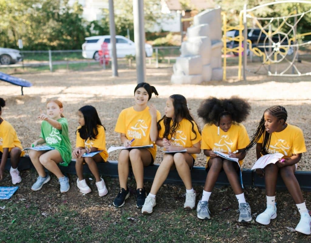 Group of girls sharing journals